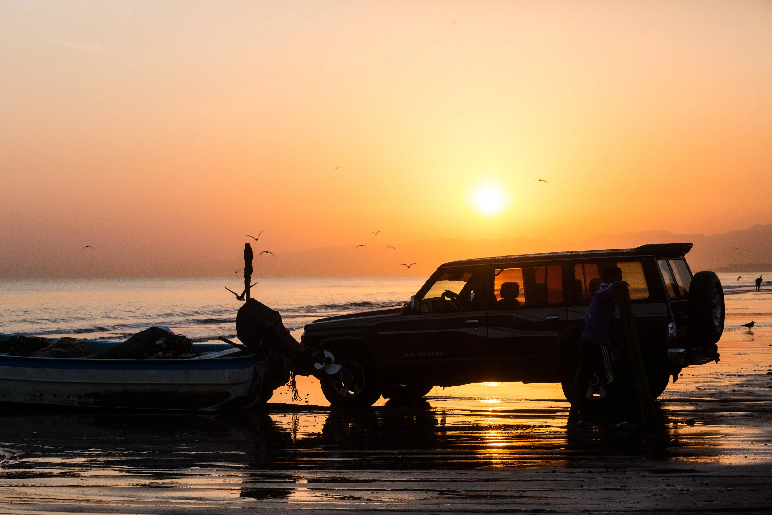  After the morning prayer before dawn,&nbsp;fishermen head out to sea from Al Seeb beach, using old jeeps and suvs to push and pull their small motorboats down make-shift tracks and into the water. The fresh fish is then sold in local soups, or froze