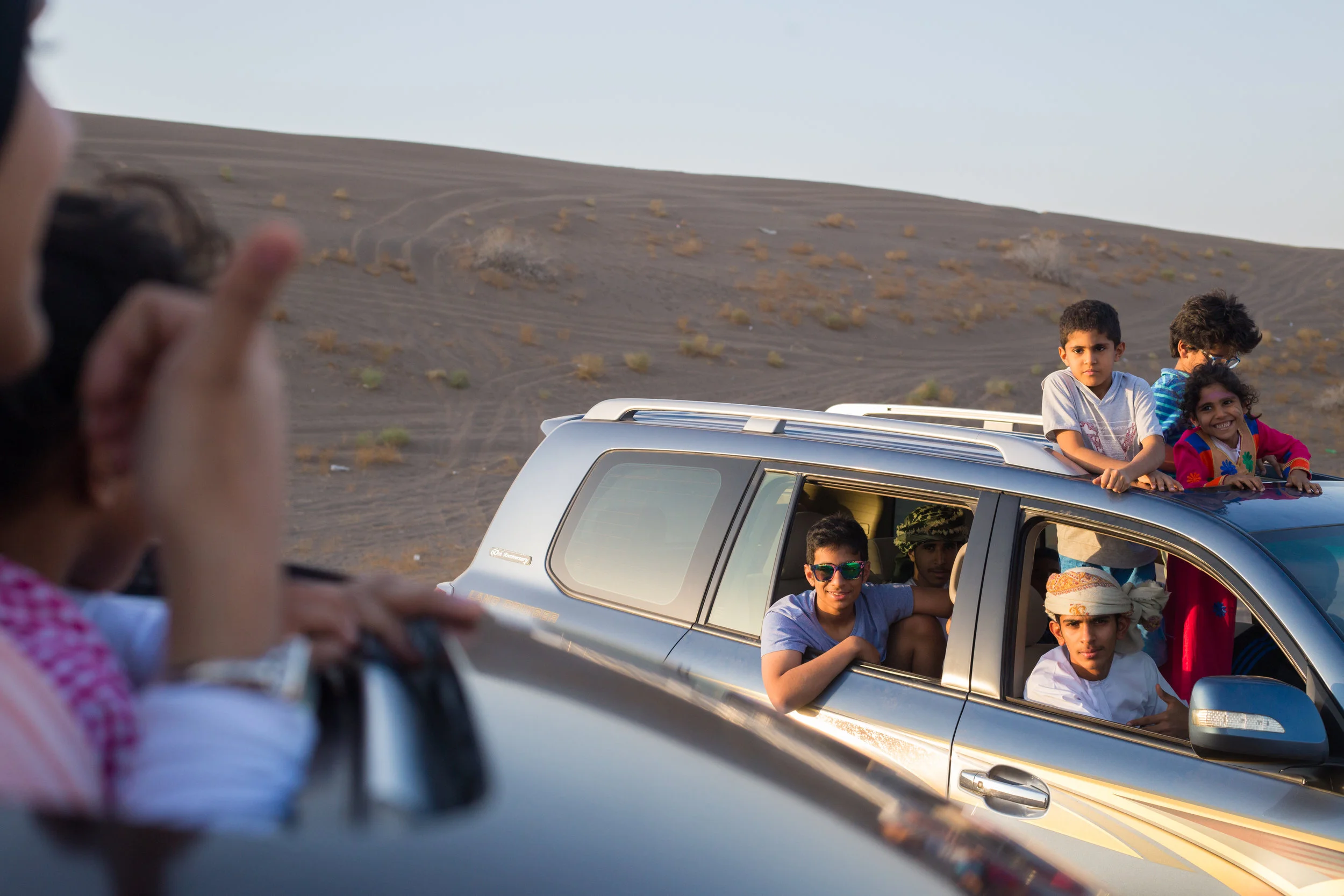 Packed into two SUVs, 16 of us drove into the desert near Al Rustaq, sitting out of windows and sunroofs to enjoy the breeze, getting out to take photos, stretch our legs, and periodically unstick the cars from the sand.&nbsp; 