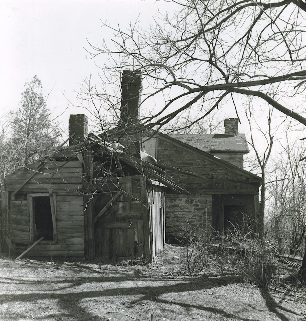  Photo shows the state of disrepair of the structure’s adjoining shed prior to the move.