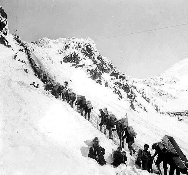 Gold seekers climb the Chilkoot Pass on their way to Dawson City and the goldfields.