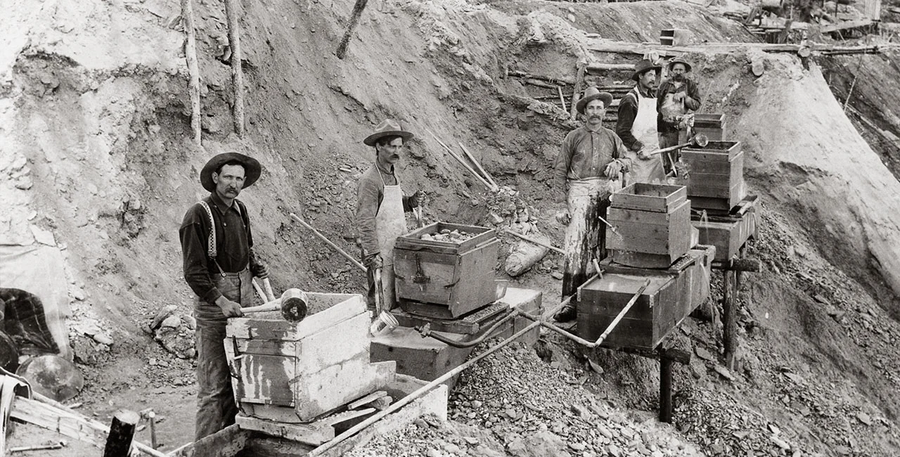 An early typical sluice box mining operation
