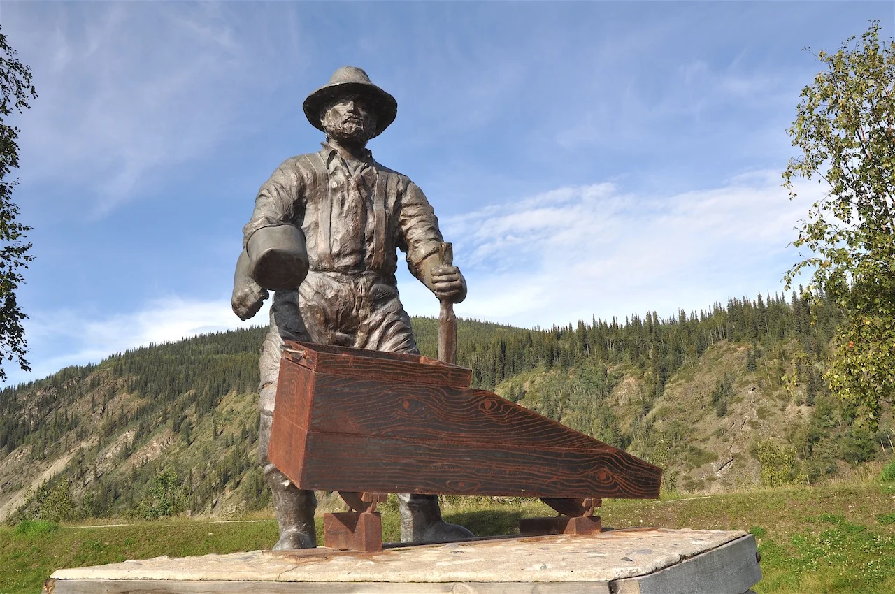 A statue honouring the early miners overlooks Dawson’s main street.