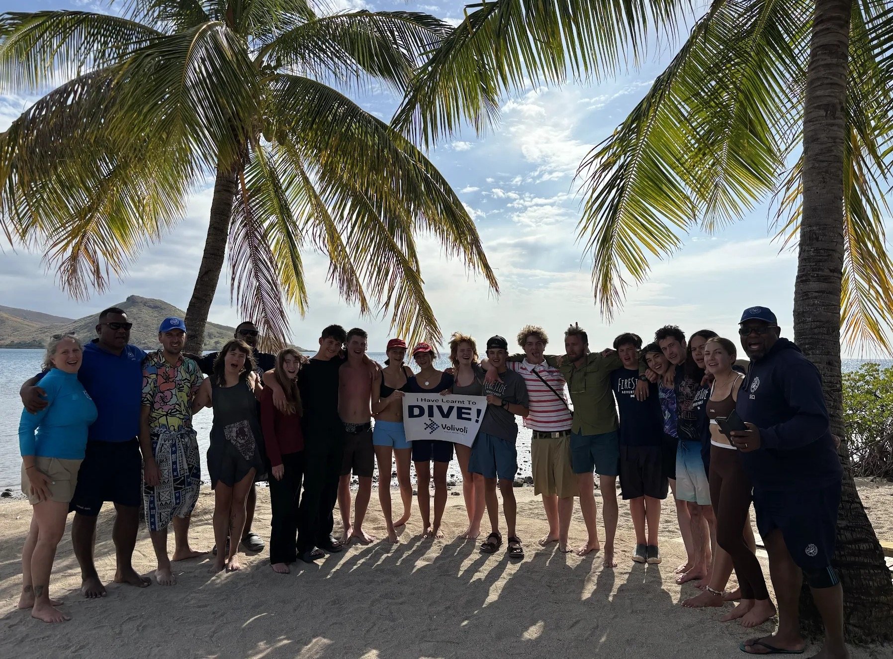 Teenagers learning scuba diving skills in Fiji with qualified instructors