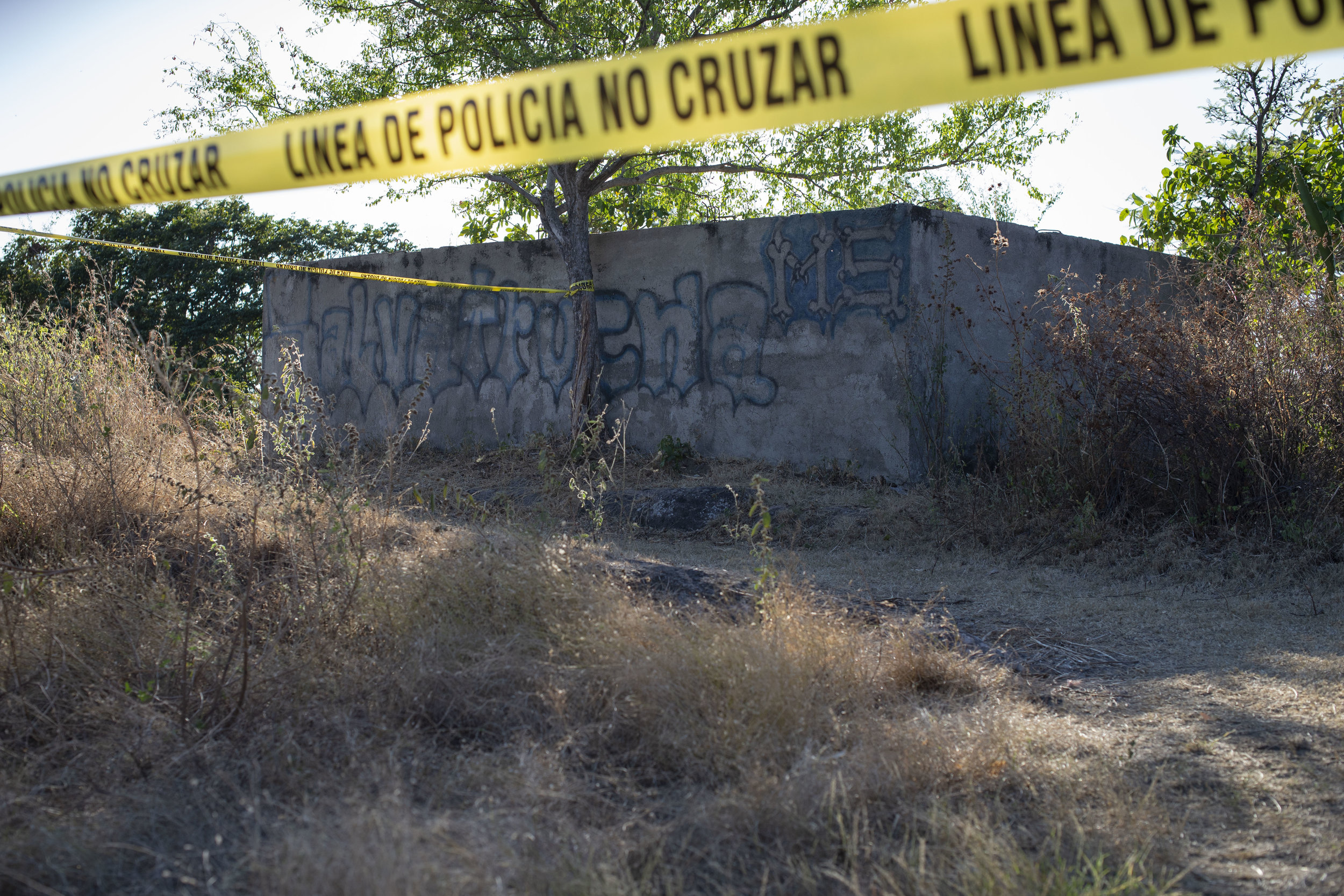  The homicide scene of a gang member named “Stupid Ant” in the outskirts of San Salvador, El Salvador.  