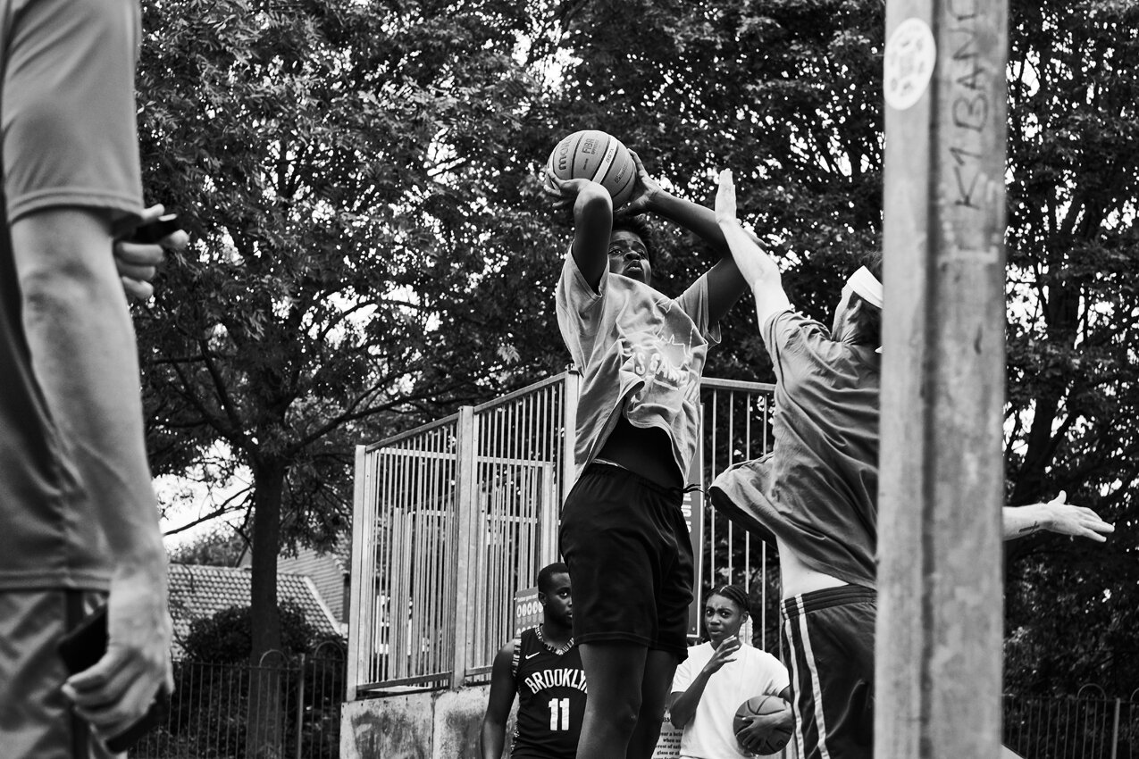 Game Time_BW_027_Afeez shoots over his oponent during play-offs.jpg