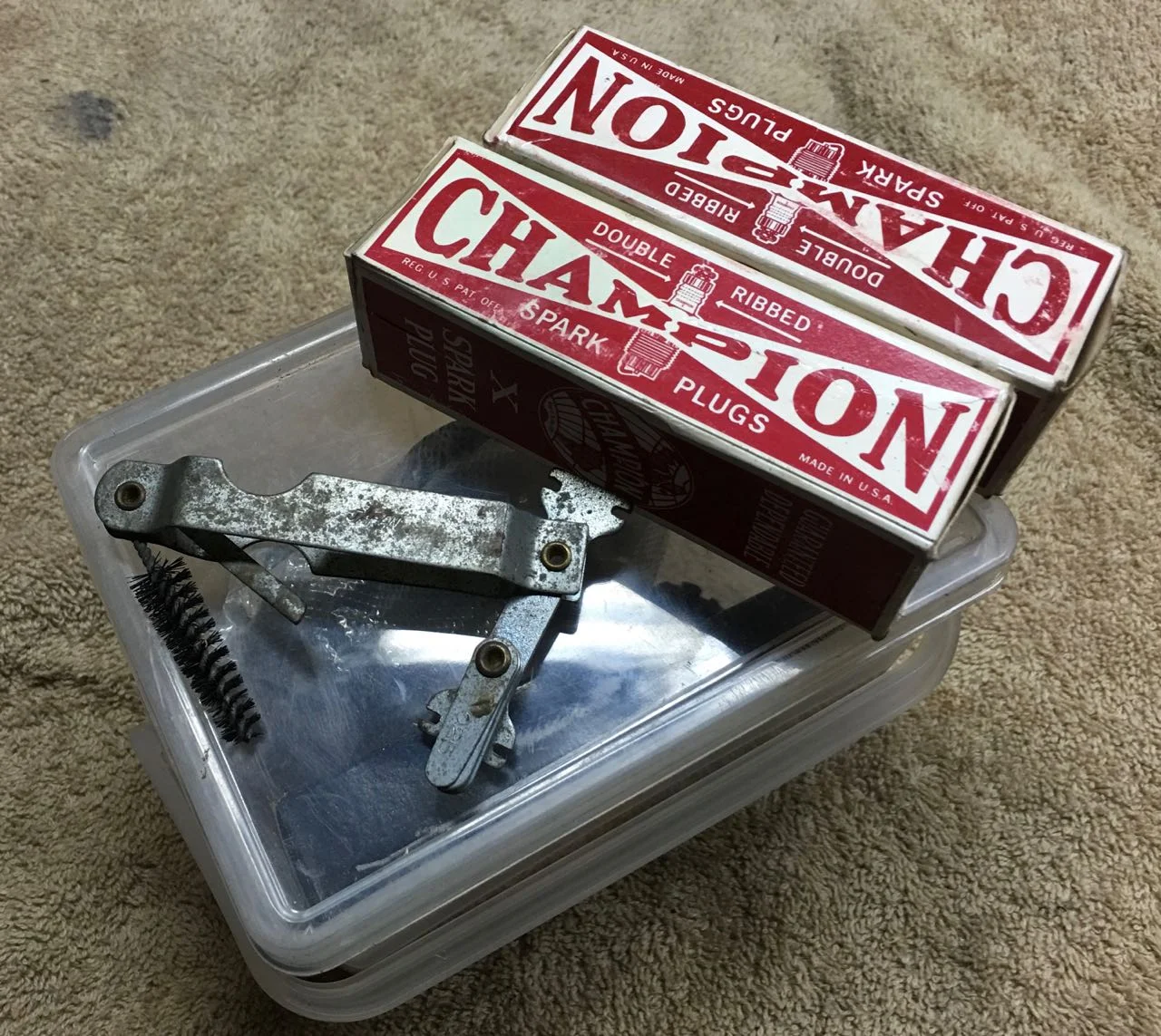 Champion X plugs have worked well for me. Also in the photo is an old plug cleaning and gapping tool.