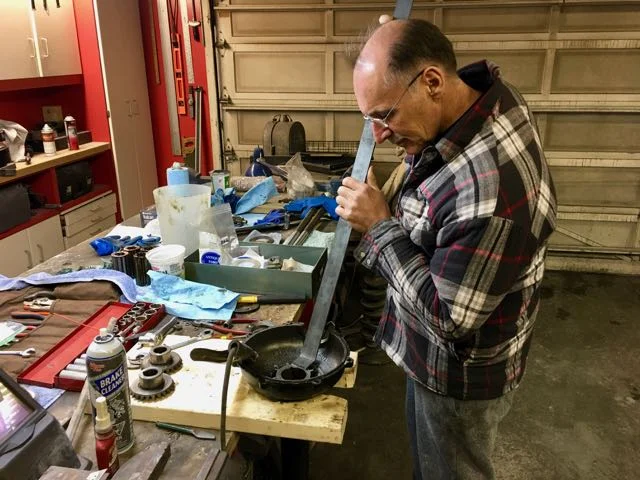 Here a piece of flat iron with a hole in it is welded to the sheared off pin.