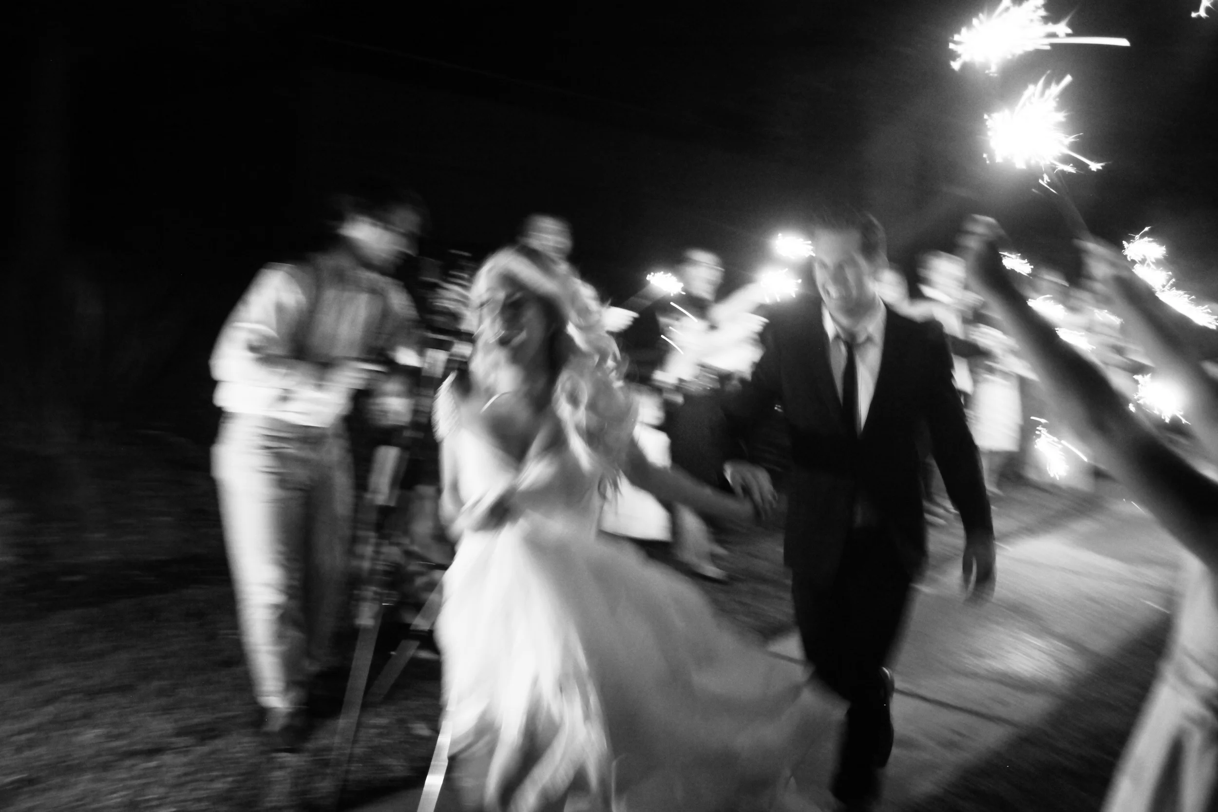 I love this final image especially because it's so blurry. You can just tell they are beyond stoked to be married and to be celebrated -- these are the true real, raw moments.