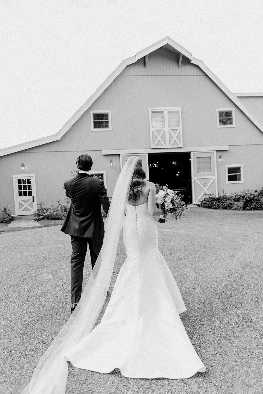 bride and groom walking away towards reception after wedding ceremony