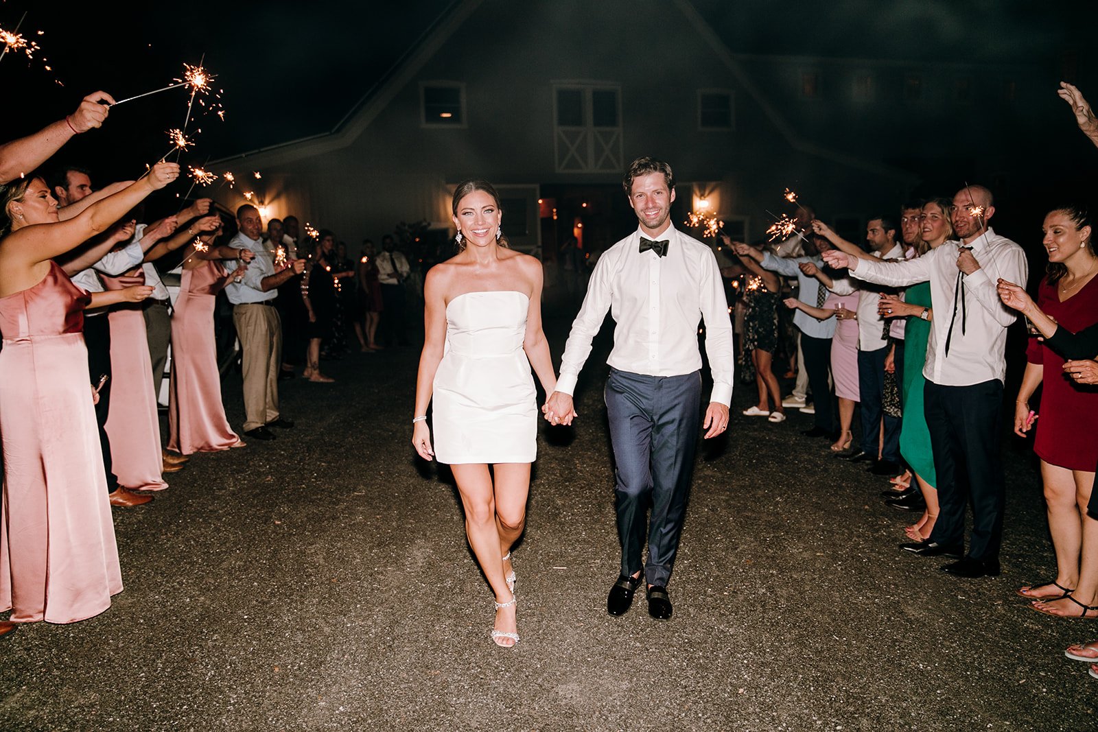 bride and groom grand exit from wedding reception with sparklers
