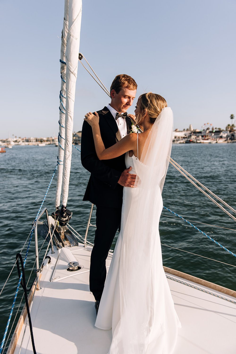 Newport Beach wedding  Christ Church ceremony  Newport Harbor Yacht Club reception  Private boat tour Newport Beach  Candid wedding photography  Timeless wedding photos  Authentic wedding storytelling