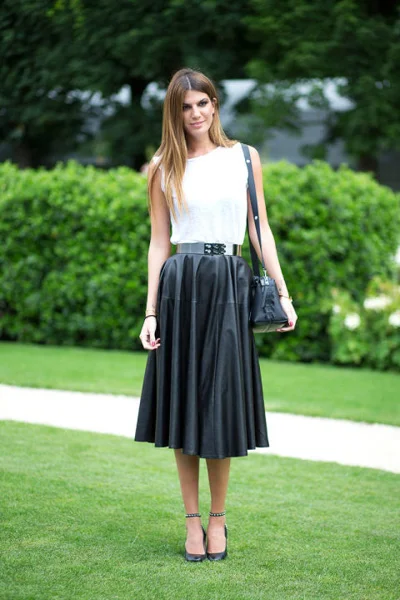White top and pleated skirt in black