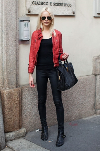 Red leather jacket over black top and jeans