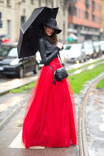 Floor-length red skirt and cropped black leather jacket