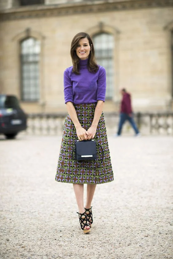 Purple sweater, brocade A-line skirt, box purse and doll shoes