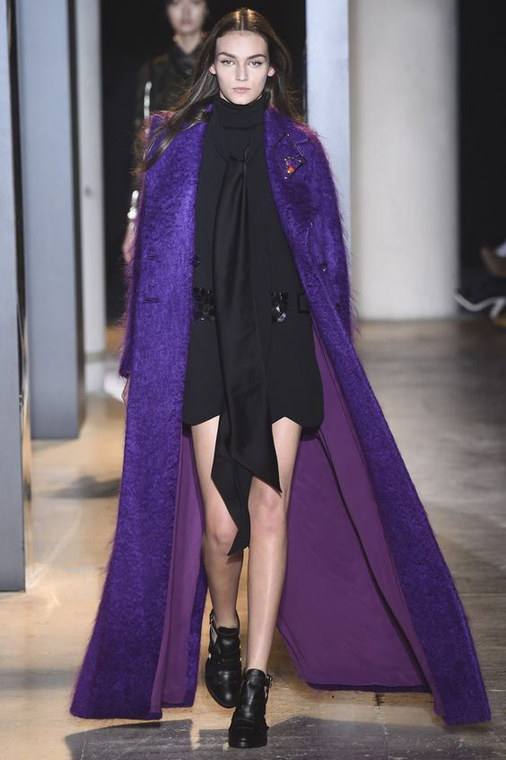 Long purple coat and black mini dress from John Galliano