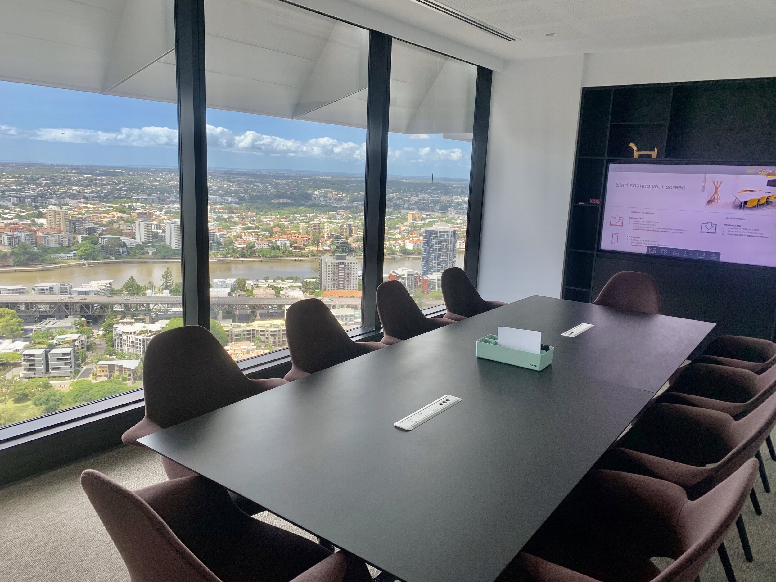 Business meeting overlooking the Brisbane river