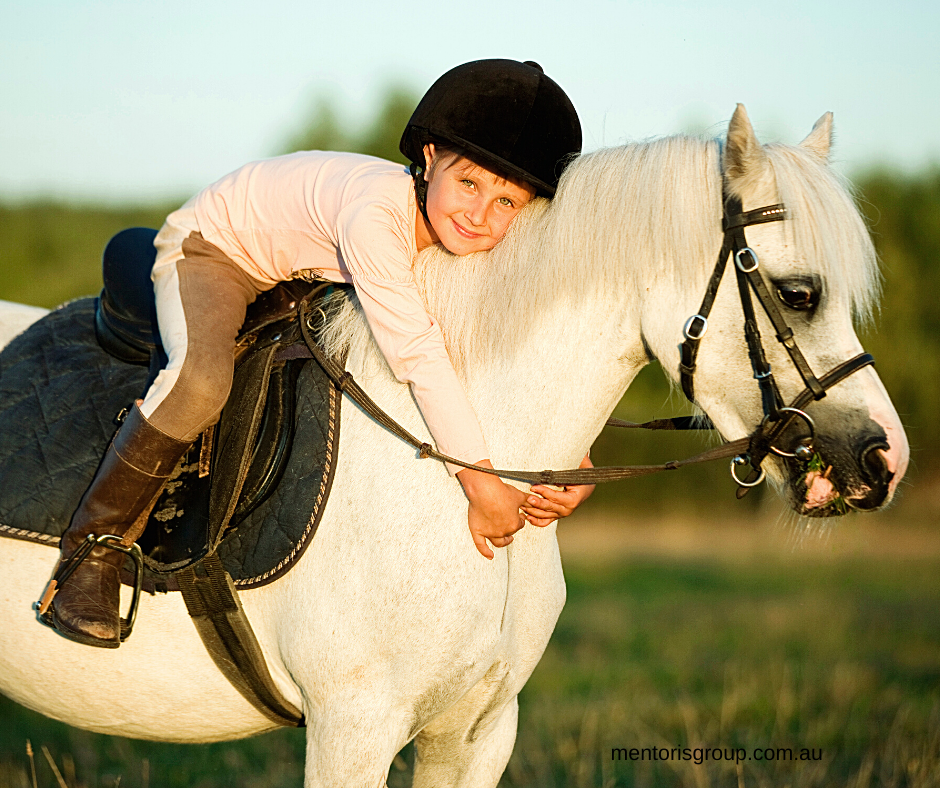 Child riding a horse