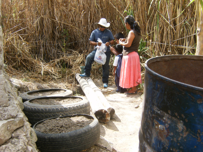 Job Gamez helps a new gardener in Honduras