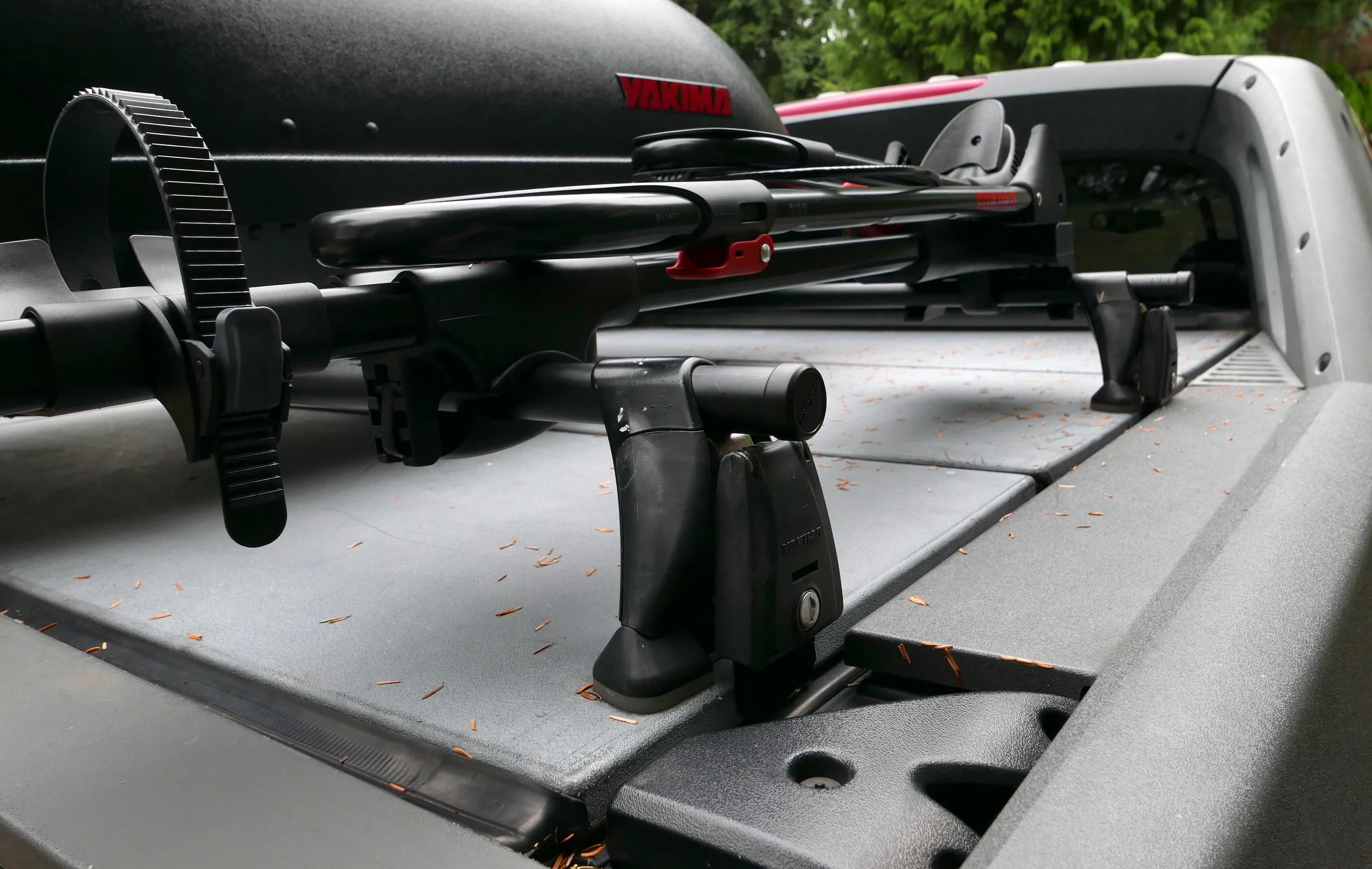 Rear rack uses Yakima Q30 Q Tower Clips and Q Towers, plus 50 inch round bars , allowing side compartments to open