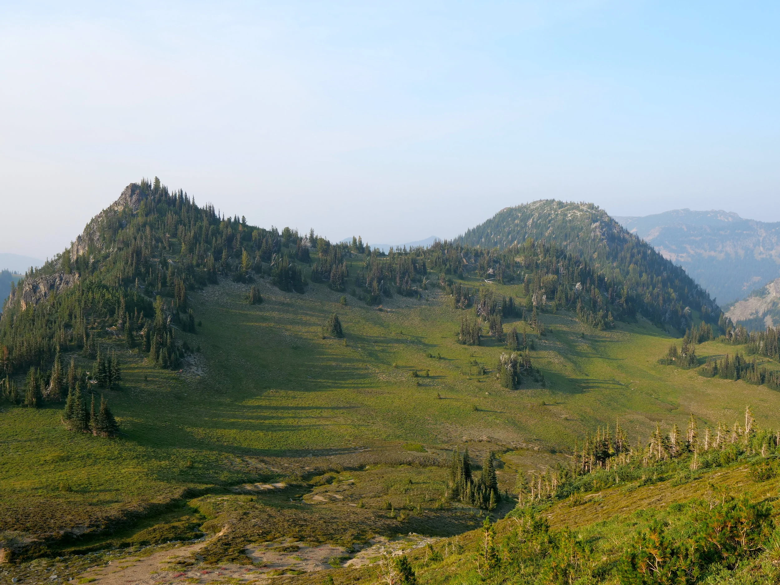 The meadow transited to access the ridge to McNeeley Peak (6786'), right frame