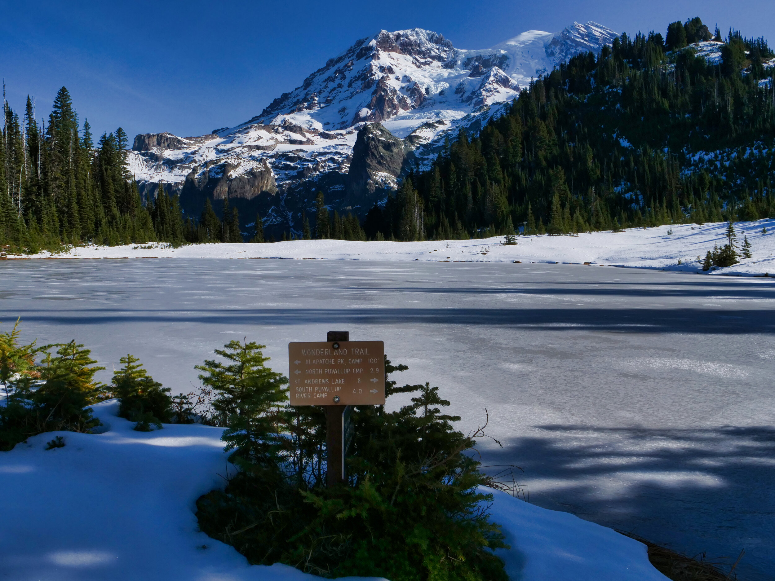 A frozen Aurora Lake with Aurora Peak (6064’) right frame