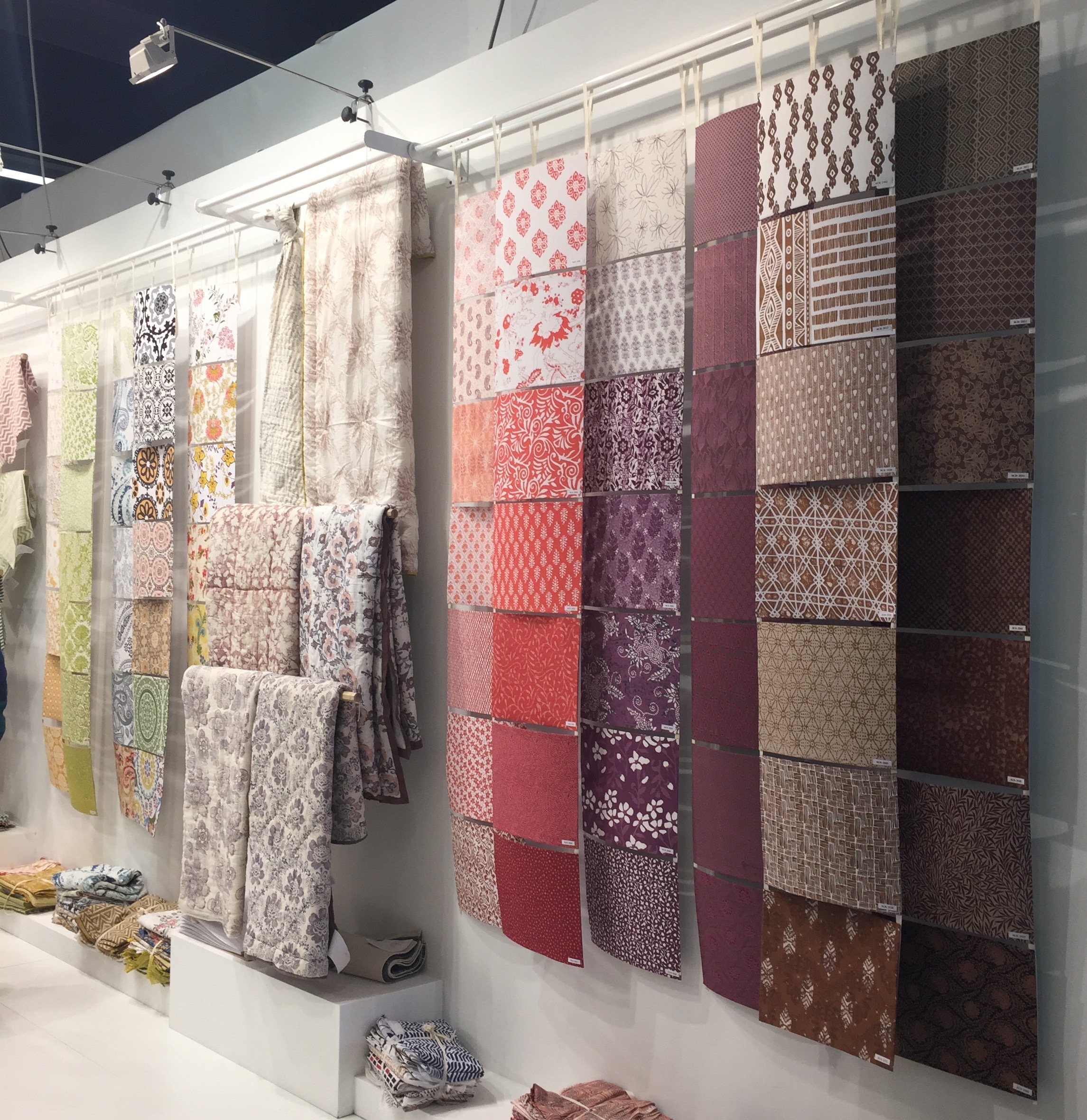 Available block prints (so many!!!) displayed beside some of the quilts that can be printed in any of the patterns from Manglam Arts