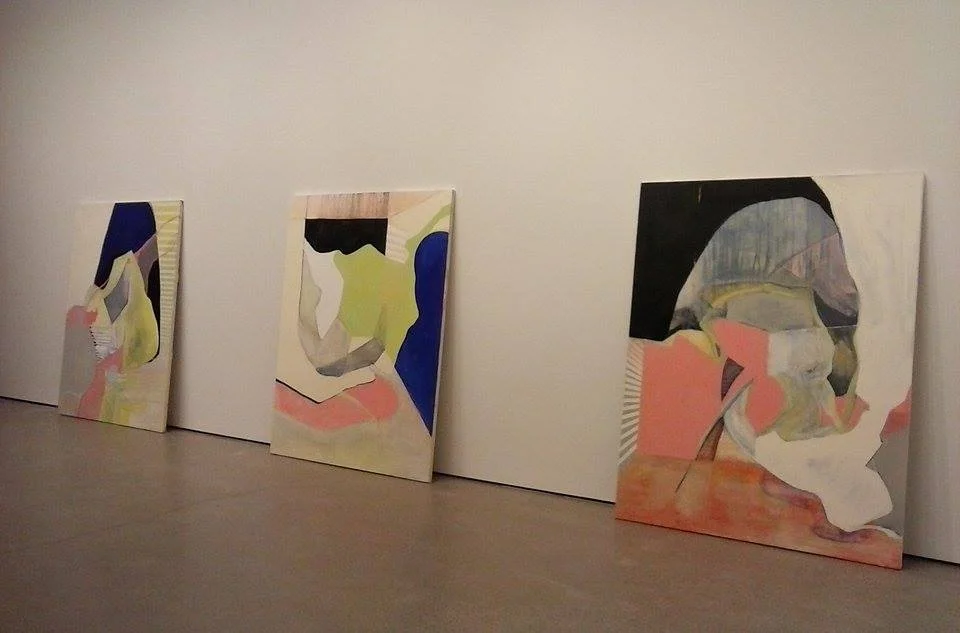 Shuffling paintings around in a gallery.