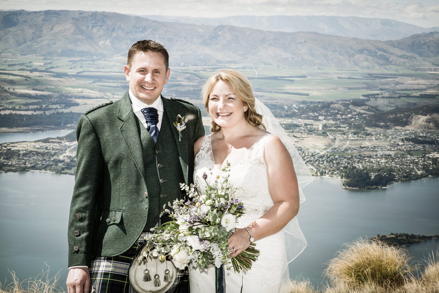 Bride and groom smile for portrait by Ruth at Fluidphoto