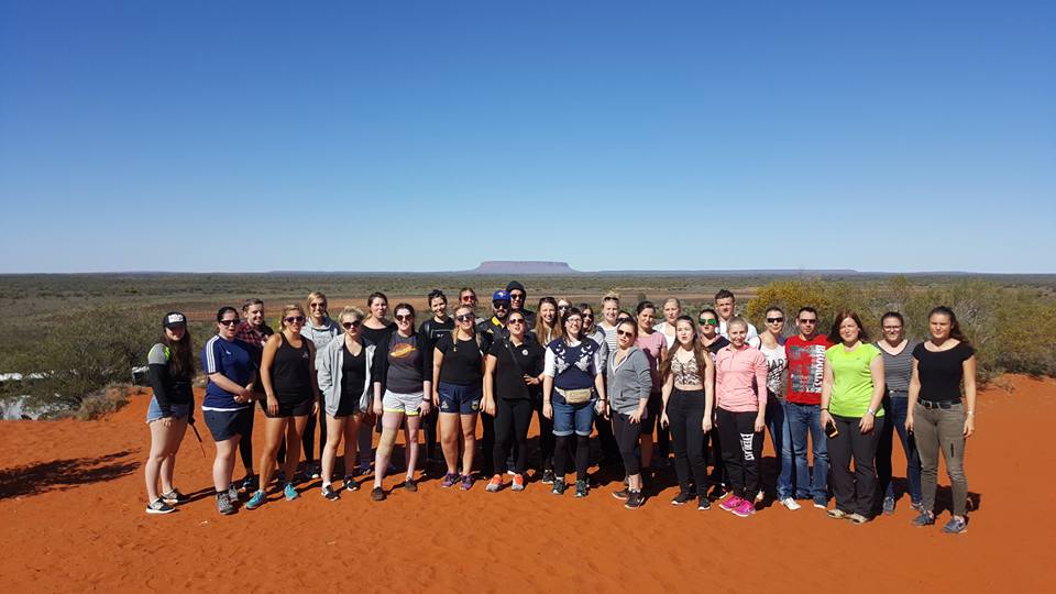 Us proudly taking a group photo in front of what we thought was Uluru... Photo Credit: Mark Davies