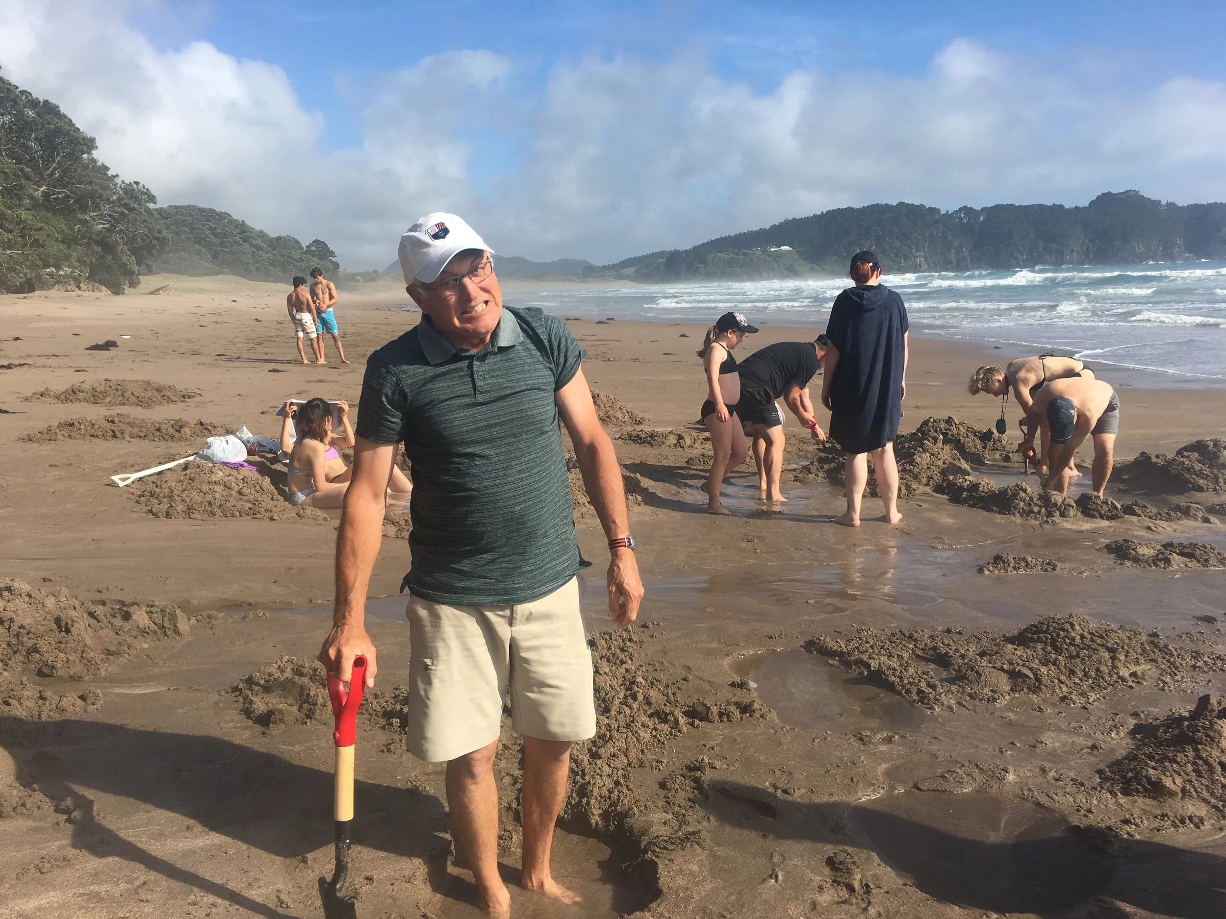 Dad digging for holes with just the right temperature….