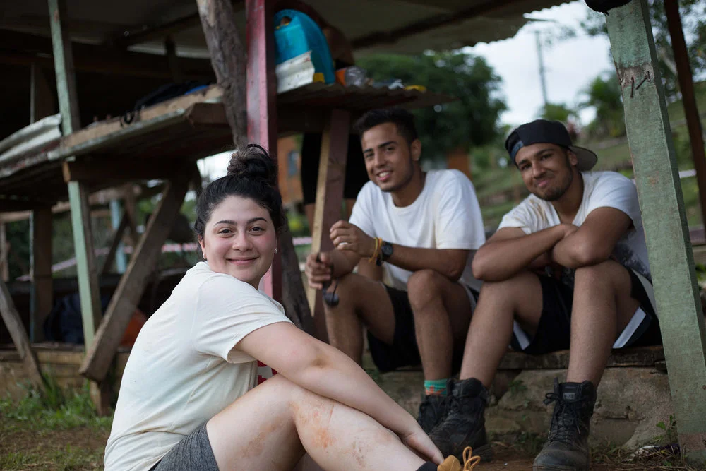 Maria, Juan and Shez (left to right) taking a break from building