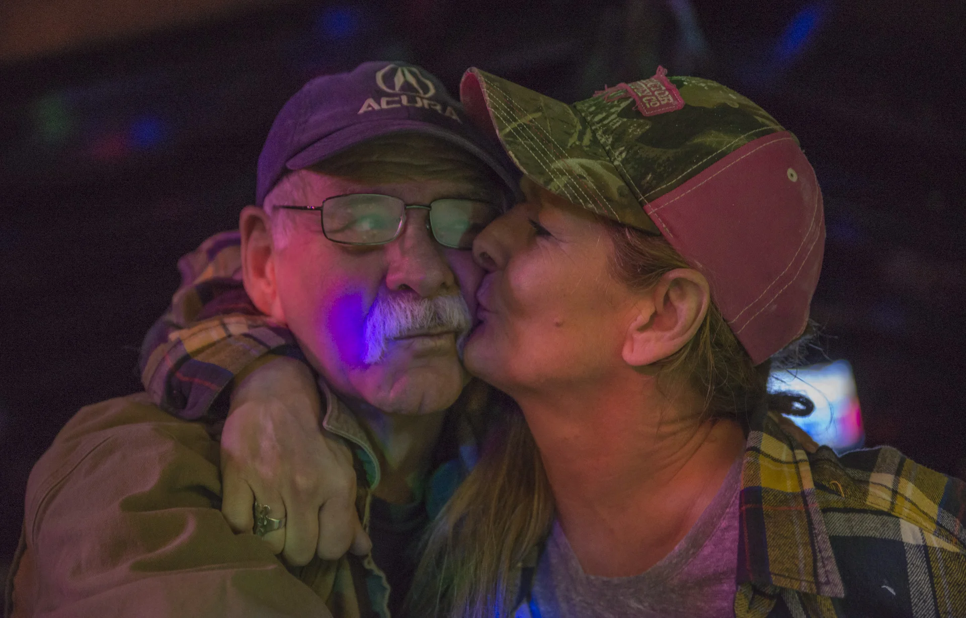 Ronnie Lowe (left) and Martha Whitely (right) share a close moment together at the Smiling Skull Saloon in Athens, Ohio on February 4, 2016.