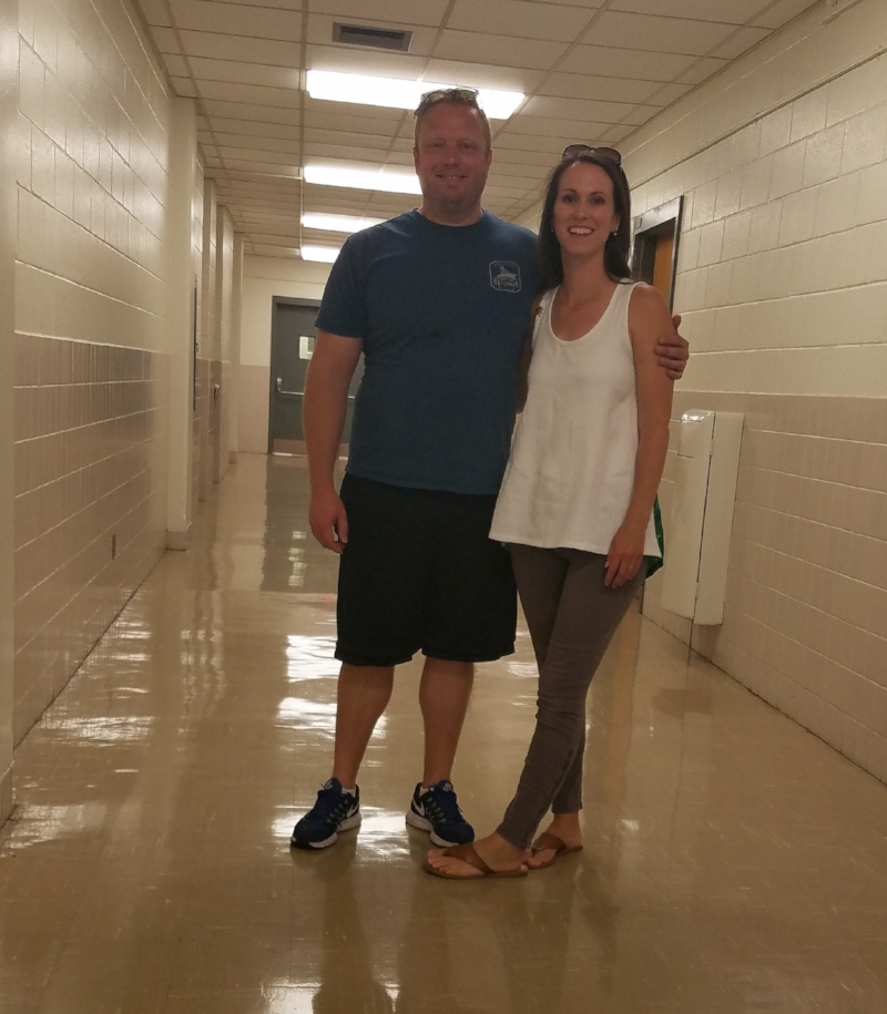 John and Virginia in a hall near the classroom that they met on Auburn University’s campus.