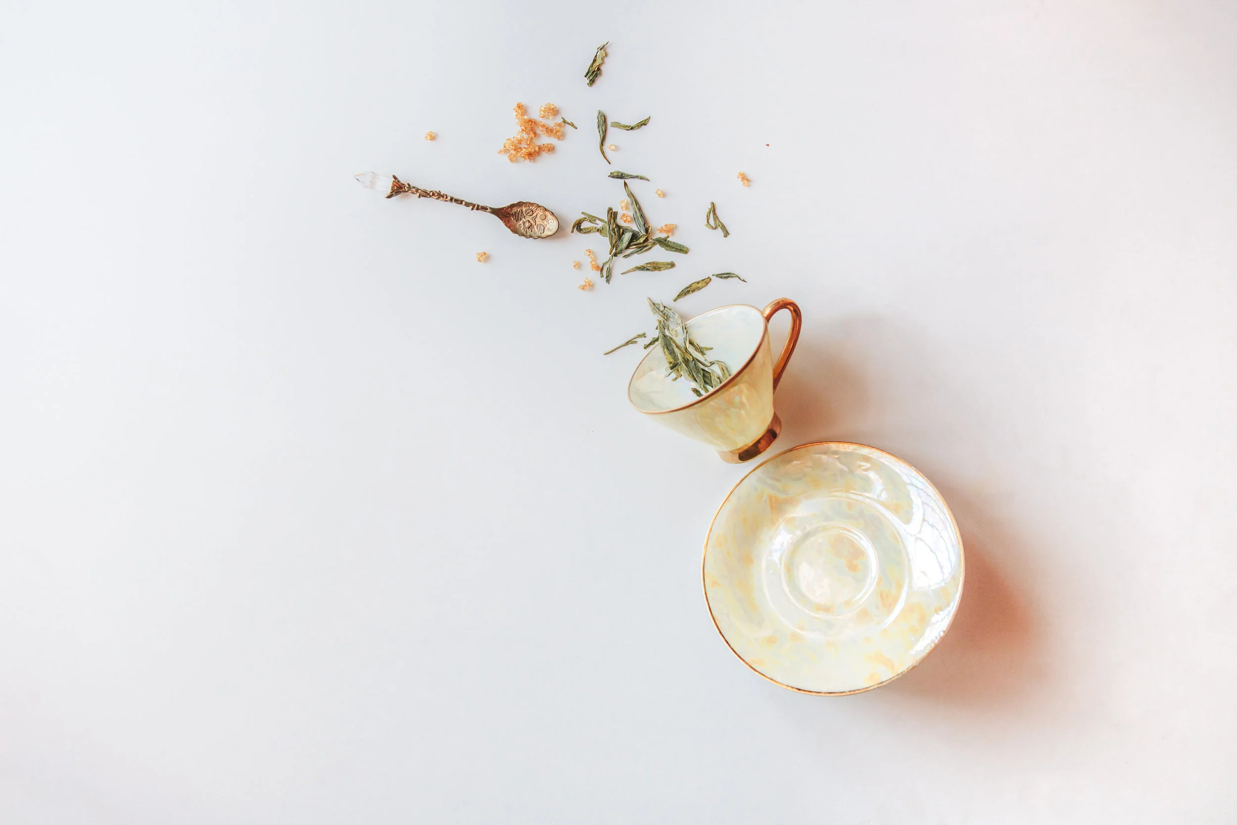 Delicately shaded pale yellow and gold tea cup, passed down from Amreen's grandmother in a set of twos to various members of the family.