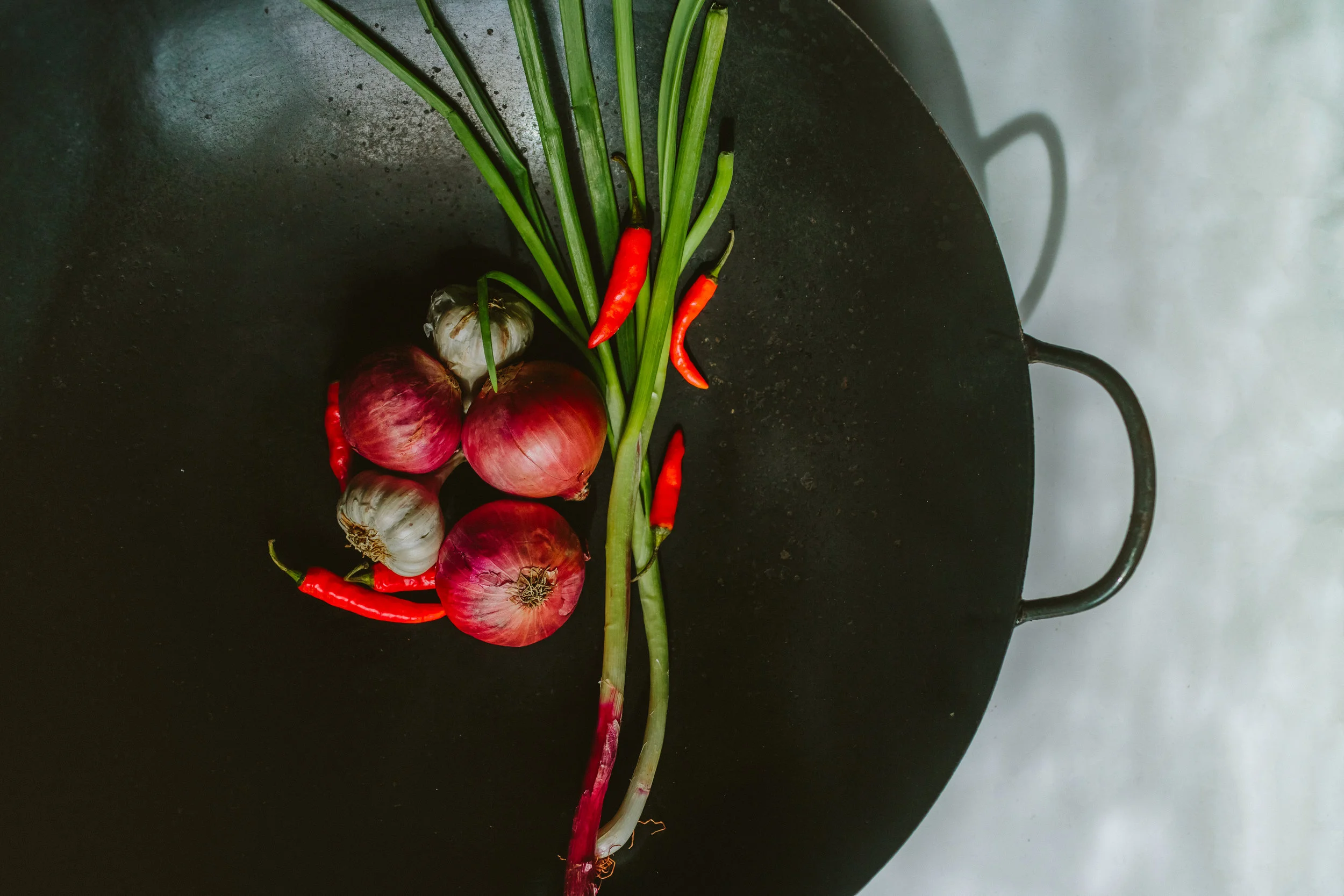 Daniel's great grandmother's wok came with the family when they left China to come to India. The wok is from a little village called, MoYan in China and has been with his family for four generations now.
