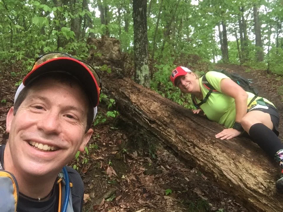 Runners trying to negotiate The Over-Under Log. Photo by Noah Moore.
