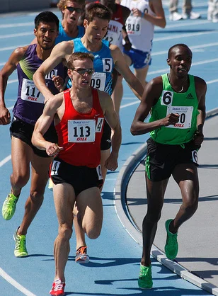 Alan Webb (red jersey) in the mile at the 2011 Drake Relays, where he finished fourth in the mile in 3 minutes, 58. 77 seconds