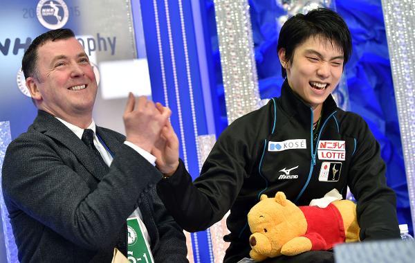 Brian Orser and Yuzuru Hanyu after the skater's record-breaking performance at the NHK Trophy last fall. (Getty Images)
