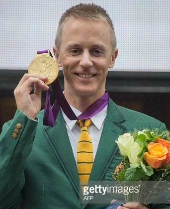 At a Friday ceremony in Melbourne, Aussie race walker Jared Tallent gets the 2012 Olympic gold medal inherited from a doping-disqualified Russian. (Getty Images) 