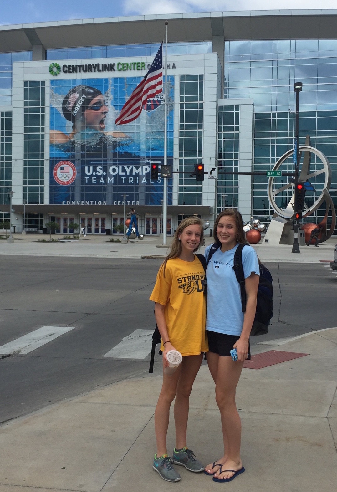 Gretchen (l) and Alex Walsh in front of the huge Katie Ledecky mural outside the site of the 2016 Olympic swim trials. (Photo courtesy Walsh family)