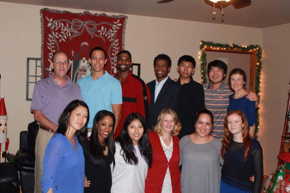 The Harrison family, which includes nine adoptees (including Keni, front row, 2d from left) among their 11 children, at Christmas 2015. (Photo courtesy Harrison family.)