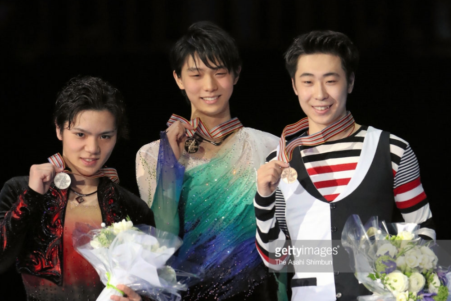 Jin Boyang (right), with Shoma Uno (left) and champion Yuzuru Hanyu at the 2017 worlds, has jumped his way to consecutive world bronze medals.