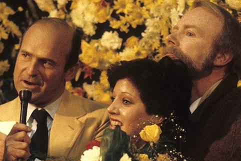 Dick Button, Linda Fratianne & Frank Carroll at the 1980 Olympics, where Fratianne won silver. (Getty images)