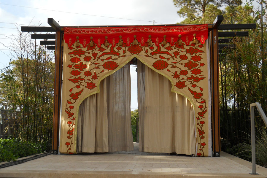 Honey Glow and orange mughal arch with red calloping and mocca drapes.jpg