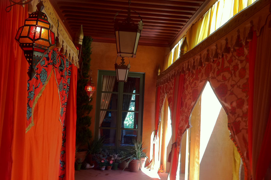 Red and orange mughal arch treatment with marakesh lamps on deck.jpg