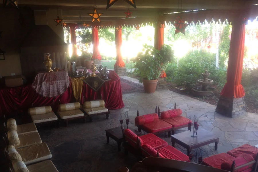 Raj Tents Home Decor themed treatment - Logia decor with draped pillars and scalloping and Raj low furniture.jpg