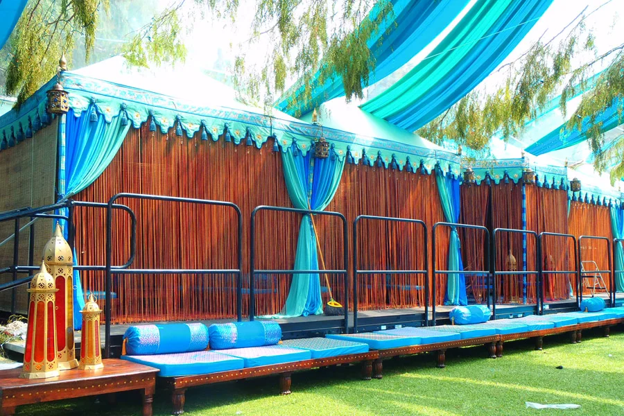 Aqua tone Pergola VIP lounges with silk string fronts.jpg