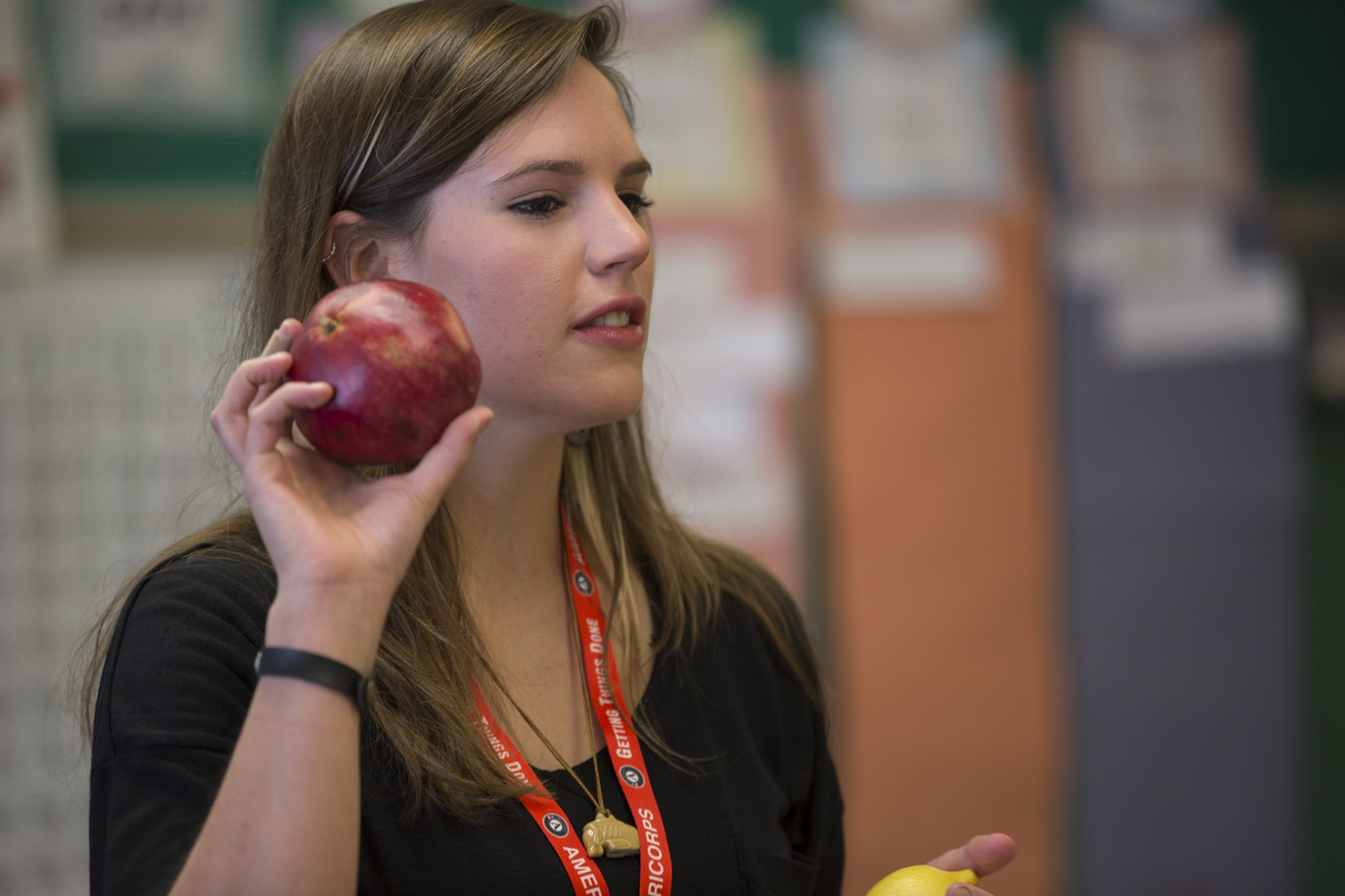 Kerrigan Boyd, a Community Food Initiatives COMCorps member, teaches Mr. Rife's second grade class at West Elementary School about healthy foods, like pomegranate, on November 13, 2015 in Athens, Ohio. 