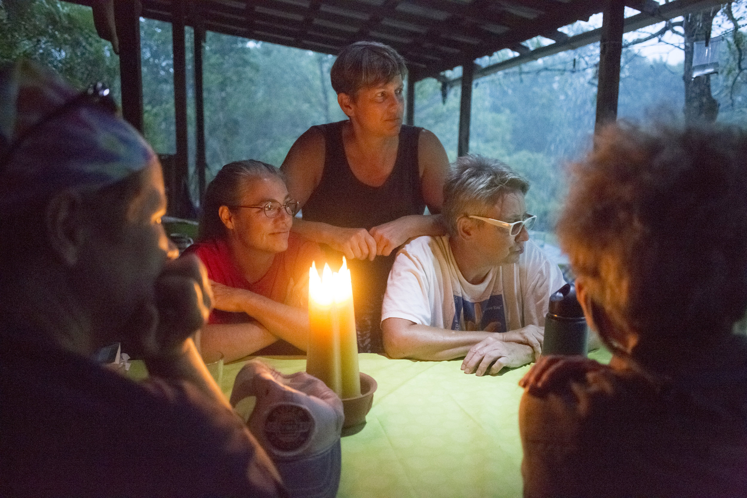  From left to right, Molly Blair, Helen M., Kristy Maki, Cindy Zeck, and Heather Cantino have a discussion with other members of the Susan B. Anthony Memorial Unrest Home Womyn's Land Trust about presidential candidates, feminism, and environmental i